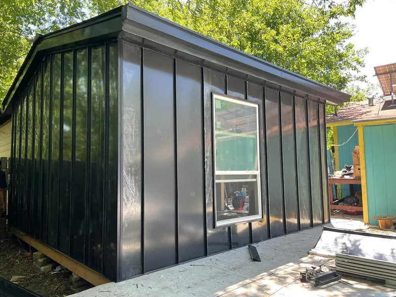 Black standing seam metal wall panels for Metal Roof Installation in Lyons