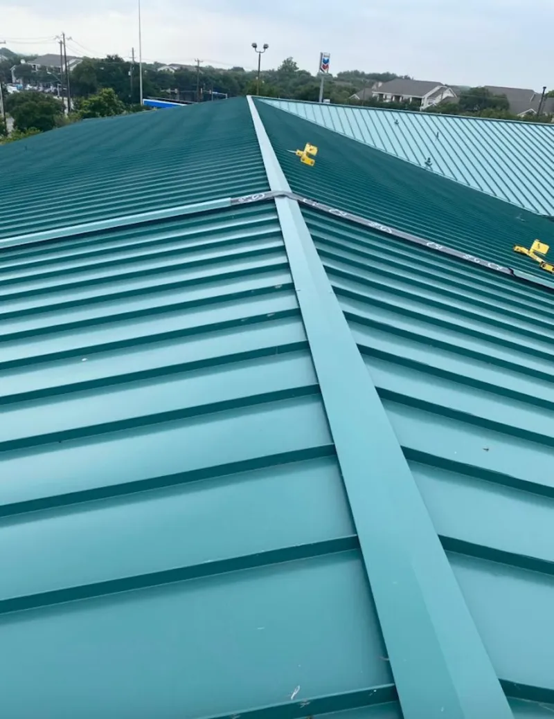 Green commercial metal roof ridge and valley for Metal Roof Repair in Lyons